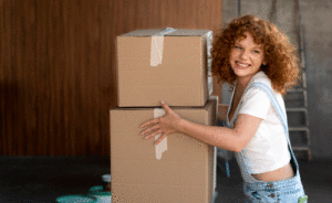 woman-handling-belongings-cardboard-boxes-moving-new-house